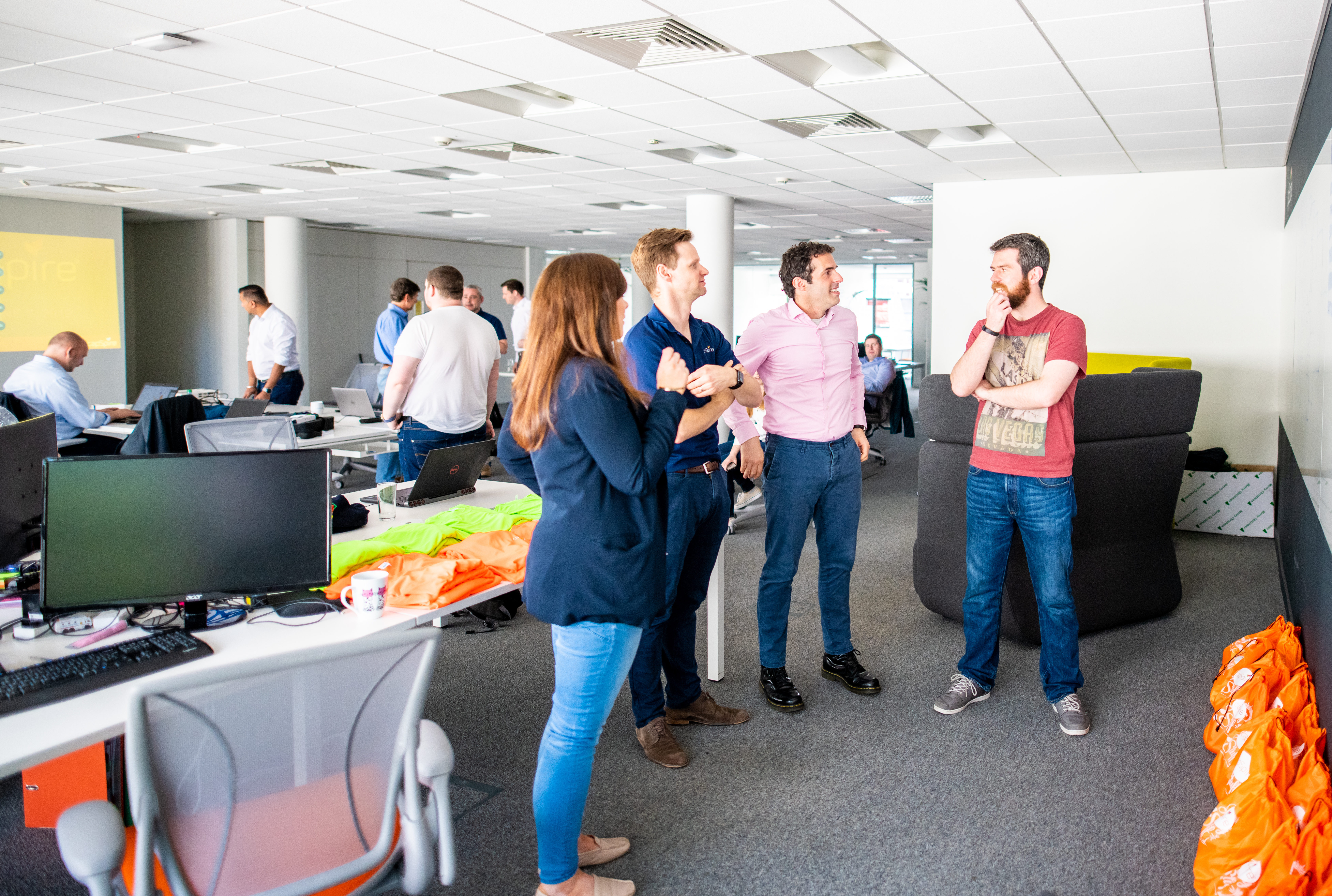 Four people discussing about some project