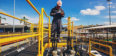 Man standing on pipes