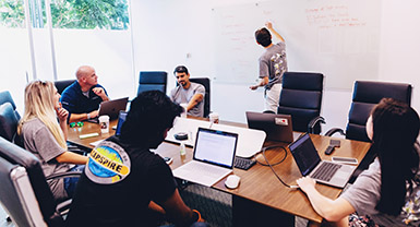 Team members planning on a big room